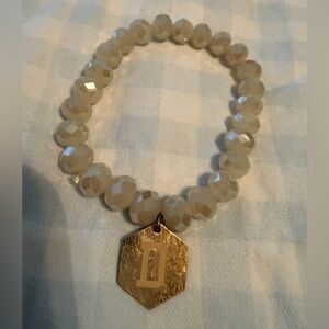 Elegant Gold and Cream Beaded Bracelet engraved initial “D”